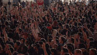 Excited basketball fans cheering and pointing, hyping each other up to get going