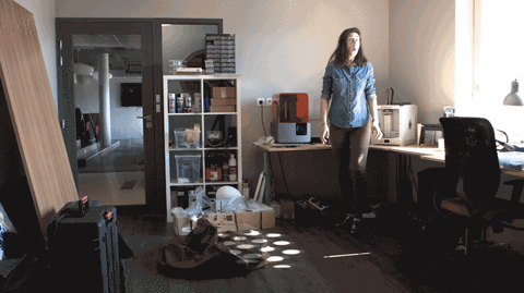A gif of a person using an invisibility cloak