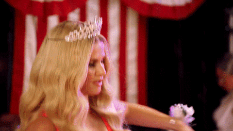GIF - A couple celebrate being crowned prom King and Queen together. 
