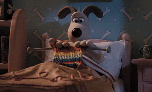 Gromit from Wallace and Gromit knitting in bed