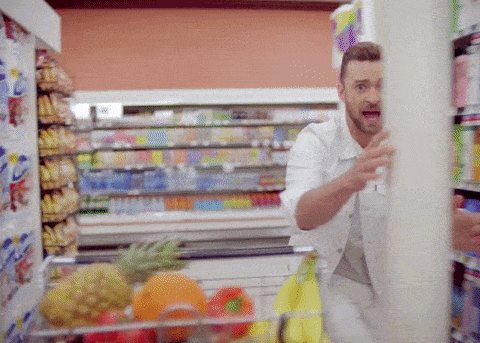 Justin Timberlake dancing around a supermarket