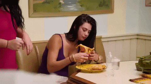 girl eating pizza 21st birthday ideas