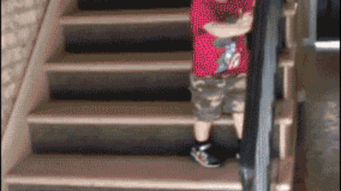 Boy climbs down stairs premature celebration Funny Gif