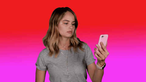 Gif of woman using a phone and saying 