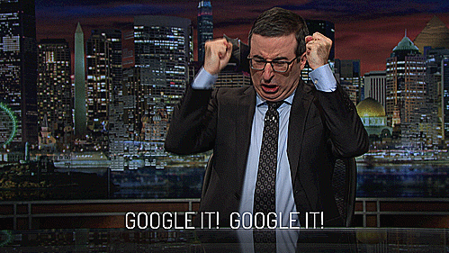 Picture of John Oliver, a talk show host with dark brown hair and glasses, pounding the desk and saying "Google It! Google It!"