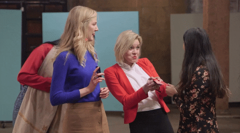 Gif of women high-fiving each other