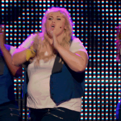 GIF from Pitch Perfect singing "who run the world? (GIRLS!")