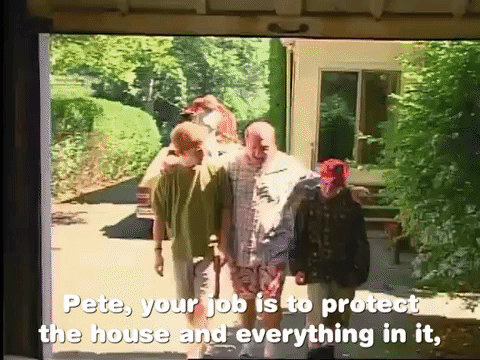 a man instructing two boys to take care of his possessions