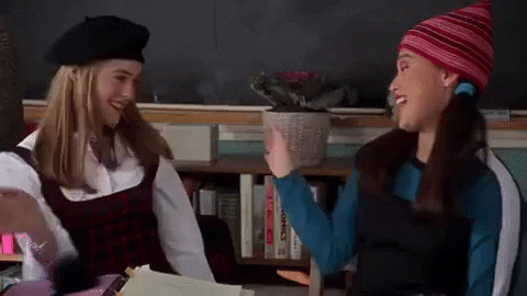 Gif of two girls giving a high five