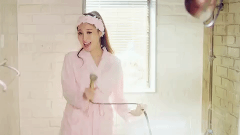 Asian woman singing in a bathrobe
