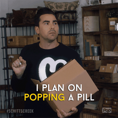 Funny David Rose (portrayed by Dan Levy) gif where he plans on popping a pill, crying a bit, and falling asleep early.