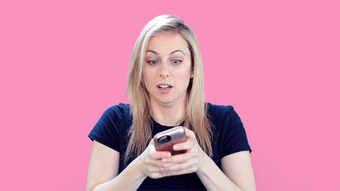 Gif of a woman typing into her phone agressively.