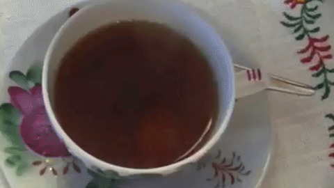 Cream Diffusing In Tea