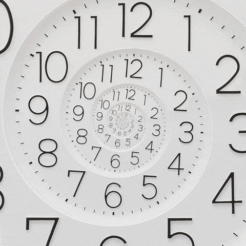 Gif of a clock slowly zooming in.