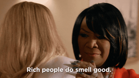Animated gif with the caption 'Rich people do smell good'