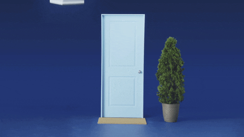 A gif of a Casper box dropping down next to a door 