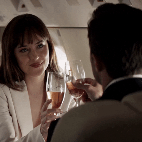 Fifty Shades Freed - When the couple clink glasses on the private jet