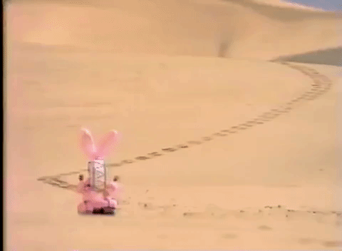 An Energizer bunny is walking in the desert with a long trail of footprints behind him.