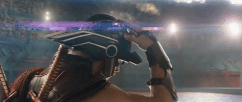 GIF of Thor (Chris Hemsworth) putting on his signature helmet in Thor: Ragnarok