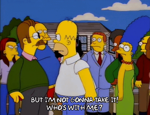 Homer Simpson lève le poing pour provoquer une rébellion du voisinage.