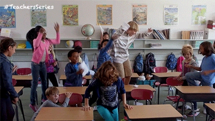 Gif of a classroom of kids throwing things at each other.