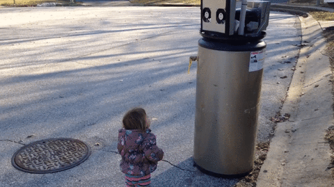 child with a water heater robot
