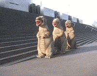 People in dino suits dancing