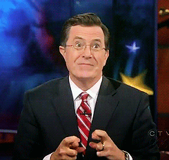 Stephen Colbert crossing his fingers