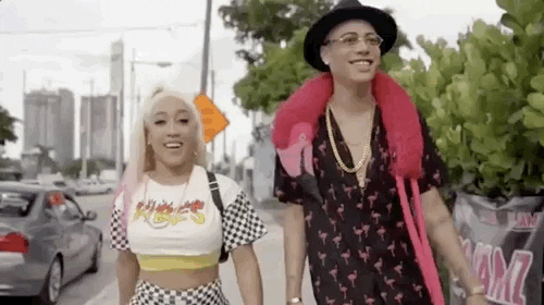[Gif description: a man and a woman smiling and laughing while walking down a street] via Giphy