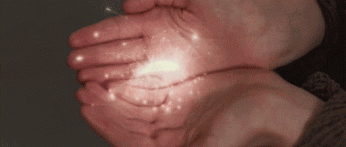 person handing over sparkles into other persons hands