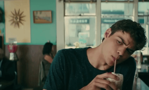 Peter K drinking a milkshake, becoming the face of rom-coms