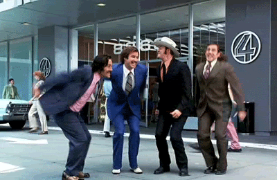 Scene from Anchorman where main characters are jumping in the air to express their happiness