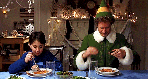 Will Ferrel as Elf eating Spaghetti with maple syrup