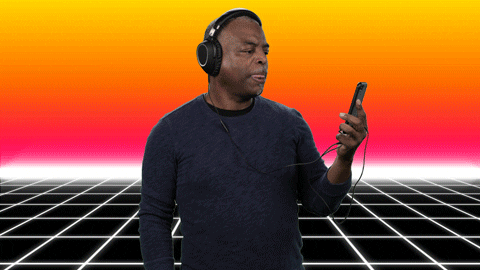 LeVar Burton wearing headphones and holding a smartphone. The subtitles say "you gotta hear this"