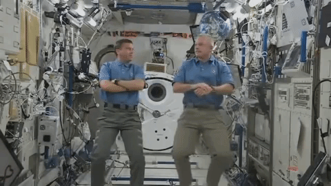 GIF of astronauts spinning in ISS