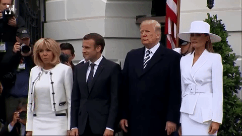 Trump attempting to hold hands with Melania Trump. Trump attempting to hold hands with Melania Trump.
