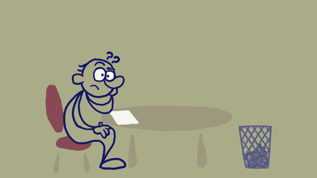 a man sitting at a table trying to come up with ideas