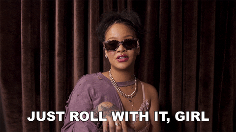 a GIF of Rihanna saying "just roll with it, girl"