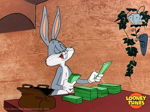 Bugs Bunny counting cash and stacking it into piles.