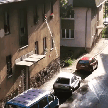 Guy washing car from his window in funny gifs