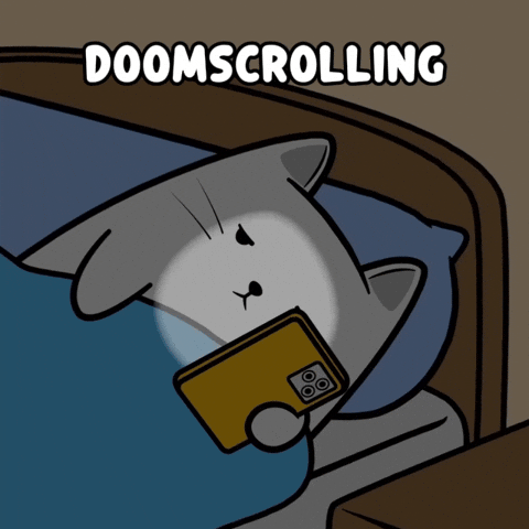 Someone in bed scrolling on their phone, glowing screen lighting their face