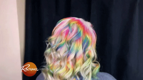 woman facing backwards showing her rainbow colored hair