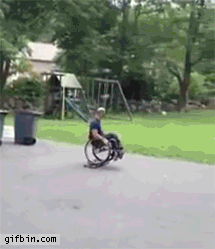 Man in wheelchair skateboarding