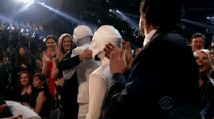 Daft Punk members hugging at awards show 