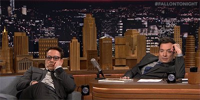 Robert Downey Jr. and Jimmy Fallon slouching on the Tonight Show