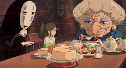 the scene from Spirited Away with 
Chihiro Ogino, Yubaba, and Kaonashi sitting around a table eating