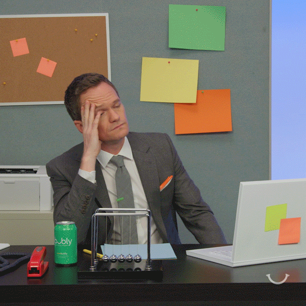 a gif of a man exhausted at the office