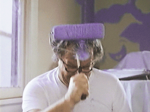 Man Painting Head With Purple Paint