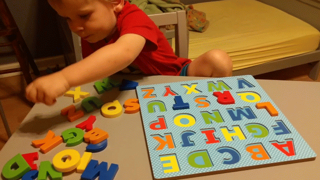 kid playing with educational toys