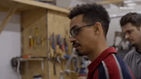 Person doing an exaggerated double take in surprise, reacting to seeing something unexpected.